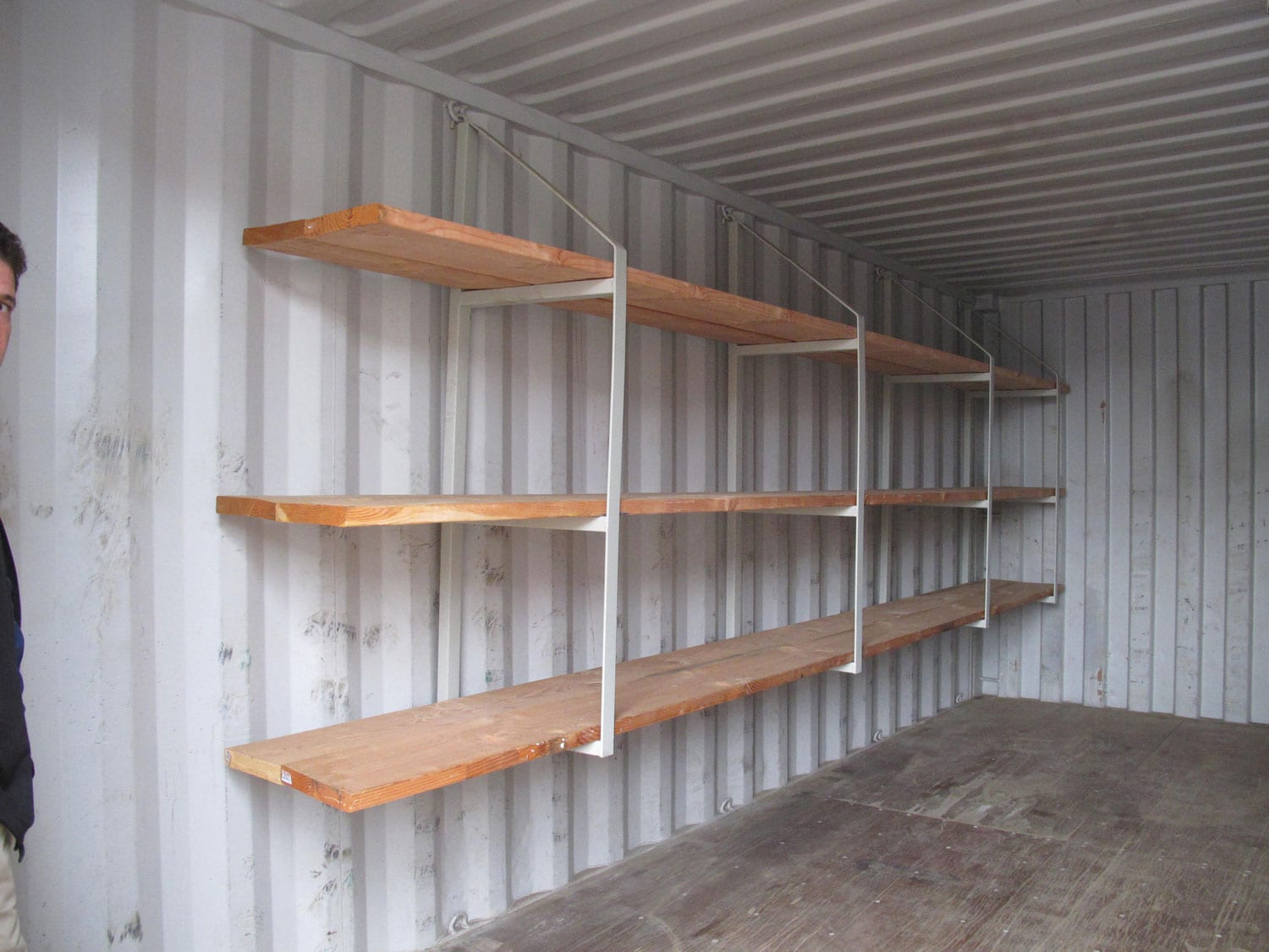 TRS has an economical shelving system that hangs from the D-rings