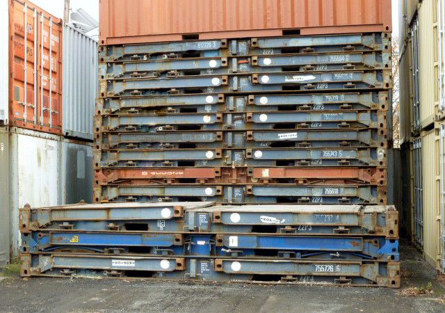 Stacked 20ft long collapsible flatracks for overseas shipping